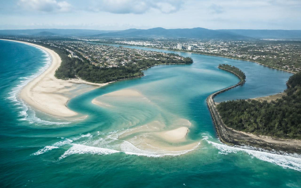 Aerial view of a river mouth meeting the sea on the Australian east coast
